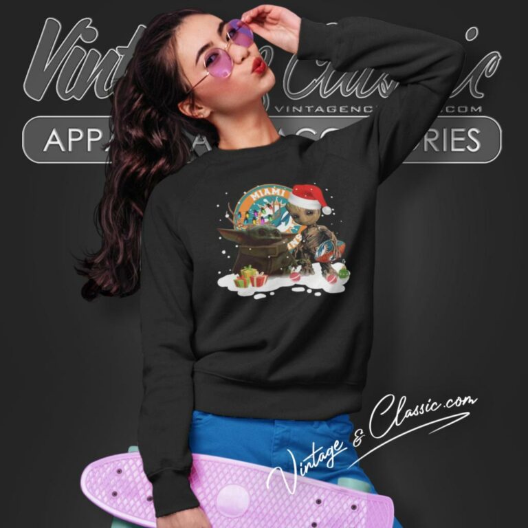 Baby Yoda Reindeer And Santa Groot Hug Miami Dolphins Christmas Sweatshirt Baby Yoda Reindeer And Santa Groot Hug Miami Dolphins Christmas Sweatshirt