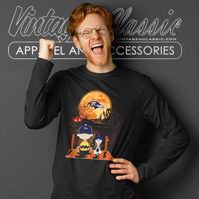 Charlie Brown And Snoopy Watching Baltimore Ravens Halloween Long Sleeve Tee Charlie Brown And Snoopy Watching Baltimore Ravens Halloween Long Sleeve Tee