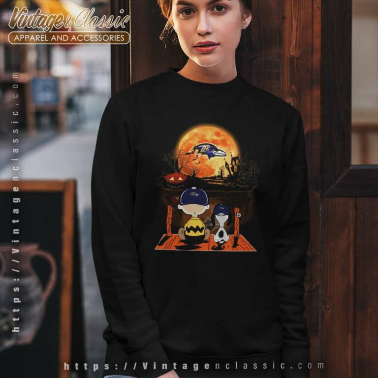 Charlie Brown And Snoopy Watching Baltimore Ravens Halloween Sweatshirt Charlie Brown And Snoopy Watching Baltimore Ravens Halloween Sweatshirt