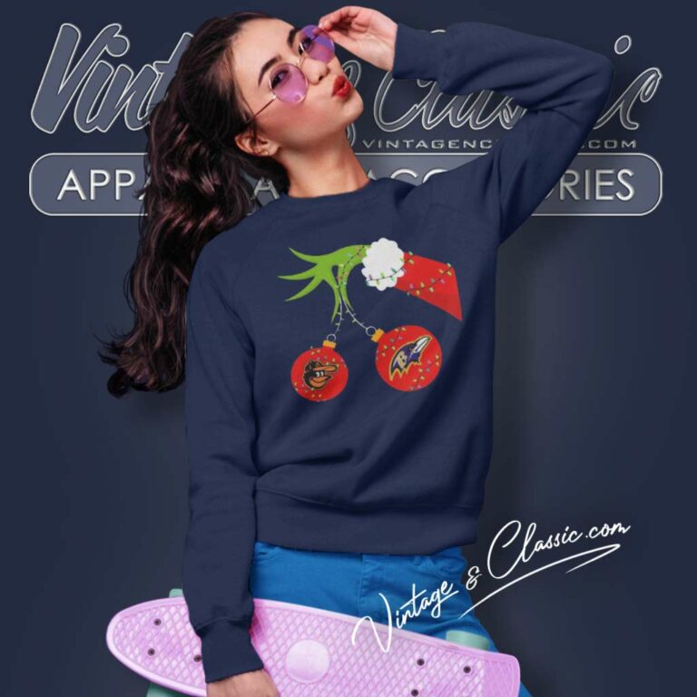 Grinch Hand Holding Orioles And Ravens Sweatshirt Grinch Hand Holding Orioles And Ravens Sweatshirt