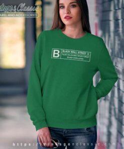 Malcolm Wearing Black Wall Street Sweatshirt