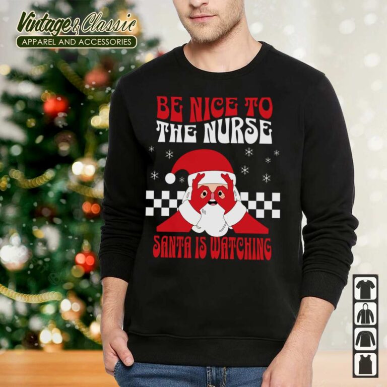 Nurse Christmas Shirt Be Nice To The Nurse Santa Is Watching Sweatshirt 2 Nurse Christmas Shirt Be Nice To The Nurse Santa Is Watching Sweatshirt 2