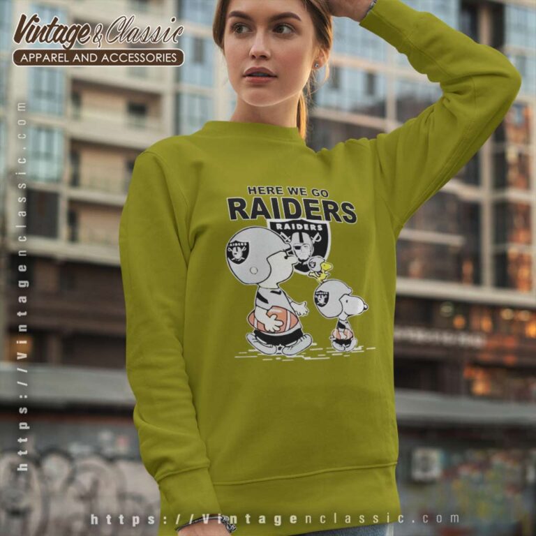 Raiders Snoopy Plays The Football Sweatshirt Raiders Snoopy Plays The Football Sweatshirt