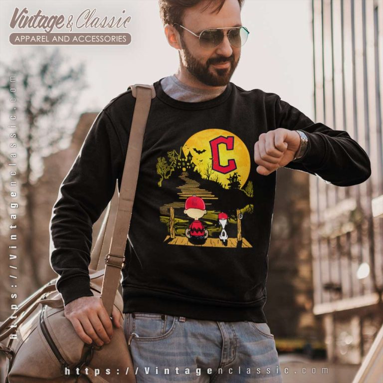 Snoopy And Charlie Brown Sit Under Moon Cleveland Guardians Halloween Sweatshirt Snoopy And Charlie Brown Sit Under Moon Cleveland Guardians Halloween Sweatshirt