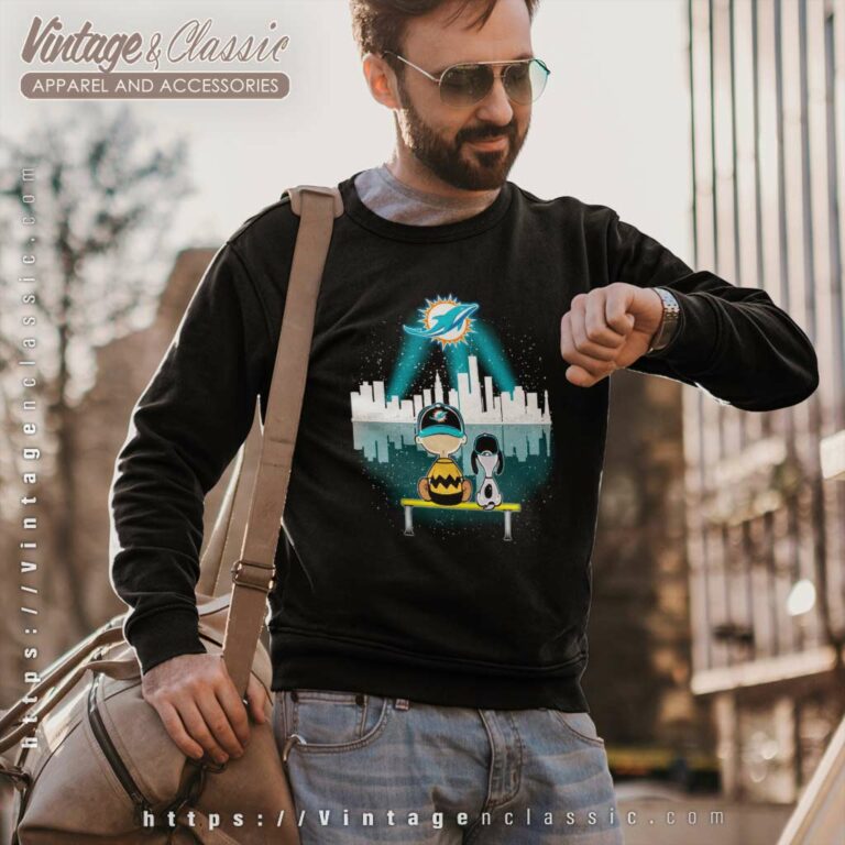 Snoopy And Charlie Brown Watching City Miami Dolphins Sweatshirt Snoopy And Charlie Brown Watching City Miami Dolphins Sweatshirt