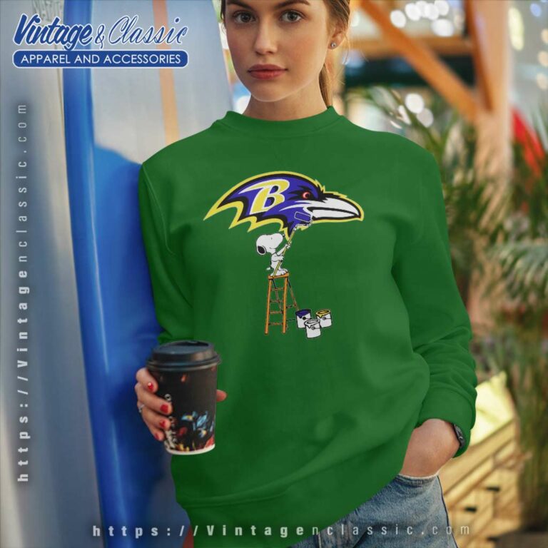 Snoopy Paints The Baltimore Ravens Logo Sweatshirt Snoopy Paints The Baltimore Ravens Logo Sweatshirt