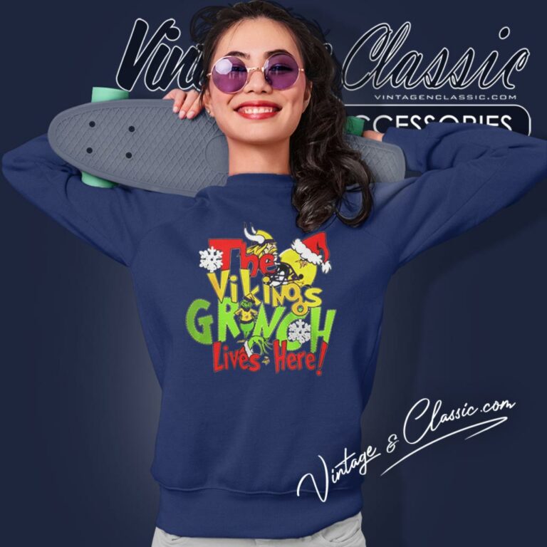 The Minnesota Vikings Grinch Lives Here Merry Christmas Sweatshirt The Minnesota Vikings Grinch Lives Here Merry Christmas Sweatshirt